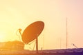 Silhouette of satellite dish antenna on top of the house Royalty Free Stock Photo