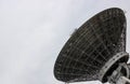 The silhouette of a satellite dish or radio antenna. Space observatory or air defense radar