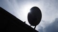 Silhouette satellite dish with sunlight on roof Royalty Free Stock Photo