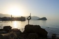 Silhouette of sculpture Ballerina Dancer from Budva in morning backlight