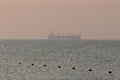 Silhouette of a sea tanker in the sea at dawn. Odesa. Ukraine Royalty Free Stock Photo