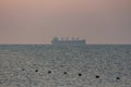 Silhouette of a sea tanker in the sea at dawn. Odesa. Ukraine Royalty Free Stock Photo