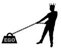 Silhouette of a selfish man with a crown on his head draws a heavy load under the name of the ego Royalty Free Stock Photo