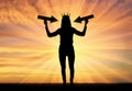 Silhouette of a selfish woman with a crown on her head