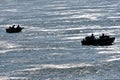 Silhouette of several fishermen fishing in rough waters Royalty Free Stock Photo