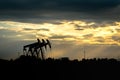 Oil field beam pump in shadow.