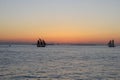 Silhouette of ships after sunset.