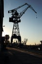 Silhouette of shipyard`s tall crane.