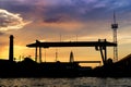 silhouette of the shipyard with sunset / sun rise screen background Royalty Free Stock Photo