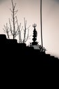 A silhouette of A Shiva temple with a trident or trishul on the top. Uttarakhand India