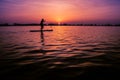 Silhouette shot of a man supping at the sea in the Netherlands