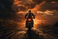 A silhouette shot of a motorcycle rider riding towards a captivating sunset.