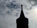 Silhouette shot of the Oberbaum Bridge Tower with a cloudscape in the background