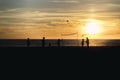 Silhouette shot of people playing beach volleyball during sunset Royalty Free Stock Photo