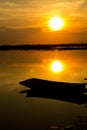 Silhouette shot, Sunset with boat over lake or pond or swamp o Royalty Free Stock Photo