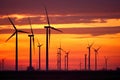 A silhouette shot of wind turbines against a colorful sunset sky. Generative AI