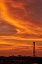 Silhouette signal antenna tower at sunrise sky Royalty Free Stock Photo