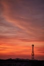 Silhouette signal antenna tower at sunrise sky Royalty Free Stock Photo