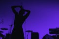 A Silhouette Of Singer Hip Hop Musician During Live Concert In Blue Light