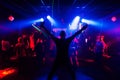 Silhouette of the singer at a live concert at the club at the event against the crowd