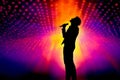 Silhouette of a singer on stage with a colorful light show in the background. Generative AI Royalty Free Stock Photo