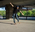 Silhouette skateboarder jumping in city Royalty Free Stock Photo
