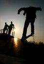 Silhouette of skateboarders in park Royalty Free Stock Photo