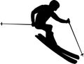 Silhouette of a skier skiing down a mountain