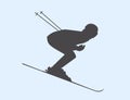 Silhouette of skier speeding down slope.