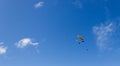 Silhouette of sky divers flies back to the ground after a tandem skydive, byron bay, queensland, australia Royalty Free Stock Photo