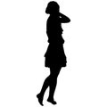 Silhouette of a slender girl in a dress barefoot