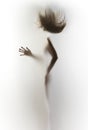 Silhouette of a slim, human body of a woman, flying hair, hand, fingers. Royalty Free Stock Photo