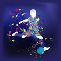 silhouette of a small football player kicking a ball drops of paint flying in motion