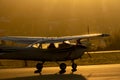 Silhouette of small propeller plane landing or taking off on the runway of Sabadell airport Royalty Free Stock Photo