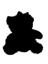 a silhouette of a small teddy doll