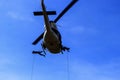 Silhouette Soldier Jump rope from helicopter in blue sky Royalty Free Stock Photo