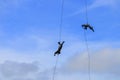 Silhouette Soldier Jump rope from helicopter in blue sky