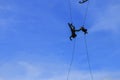 Silhouette Soldier Jump rope from helicopter in blue sky Royalty Free Stock Photo