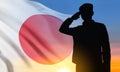 Silhouette of soldier saluting on background of susnset with Japan flag. Japan Armed Force Concept