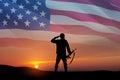 Silhouette of soldier saluting on background of USA flag. Greeting card for Veterans Day, Memorial Day. Royalty Free Stock Photo