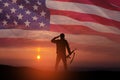 Silhouette of soldier saluting on background of USA flag. Greeting card for Veterans Day, Memorial Day. Royalty Free Stock Photo
