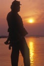 Silhouette of soldier at sunset