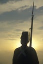 Silhouette of soldier at sunset with gun during reenactment of Battle of Manassas marking the beginning of the Civil War