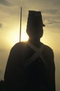 Silhouette of soldier at sunset with gun during reenactment of Battle of Manassas marking the beginning of the Civil War