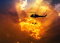 Silhouette soldiers in action rappelling climb down from helicopter with military mission counter terrorism assault training Royalty Free Stock Photo