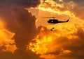 Silhouette soldiers in action rappelling climb down from helicopter with military mission counter terrorism assault training on Royalty Free Stock Photo