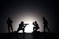 Silhouette of soldiers on a dark background