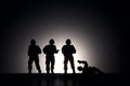 Silhouette of soldiers on a dark background