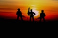 Silhouette Soldiers with sunset and copy space add text Concept stop hostilities To peace Royalty Free Stock Photo