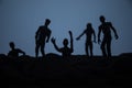 Silhouette some zombies on the cemetery walking around at sunset. Selective focus Royalty Free Stock Photo